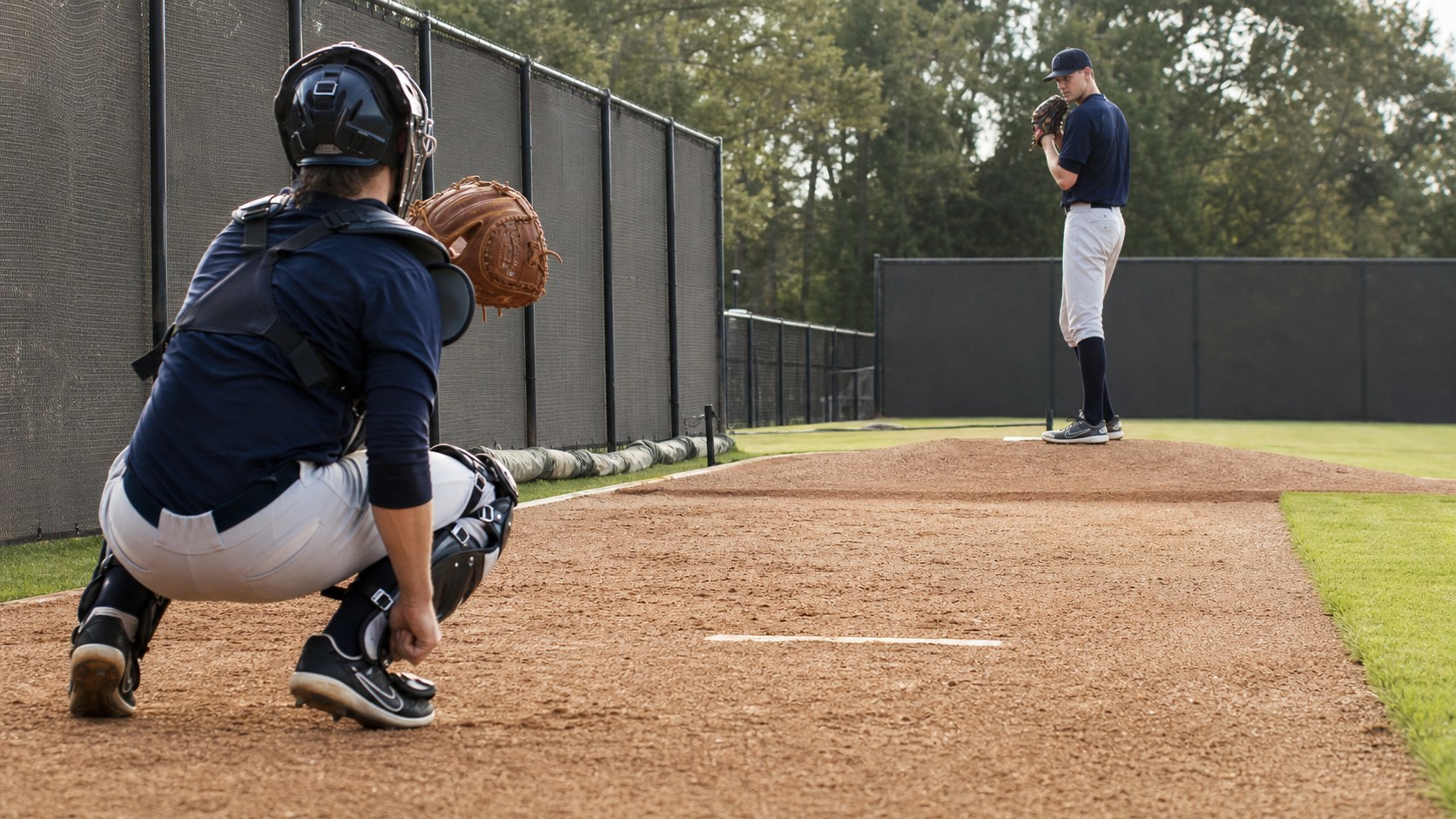 Pitcher and catcher working together during a focused bullpen session